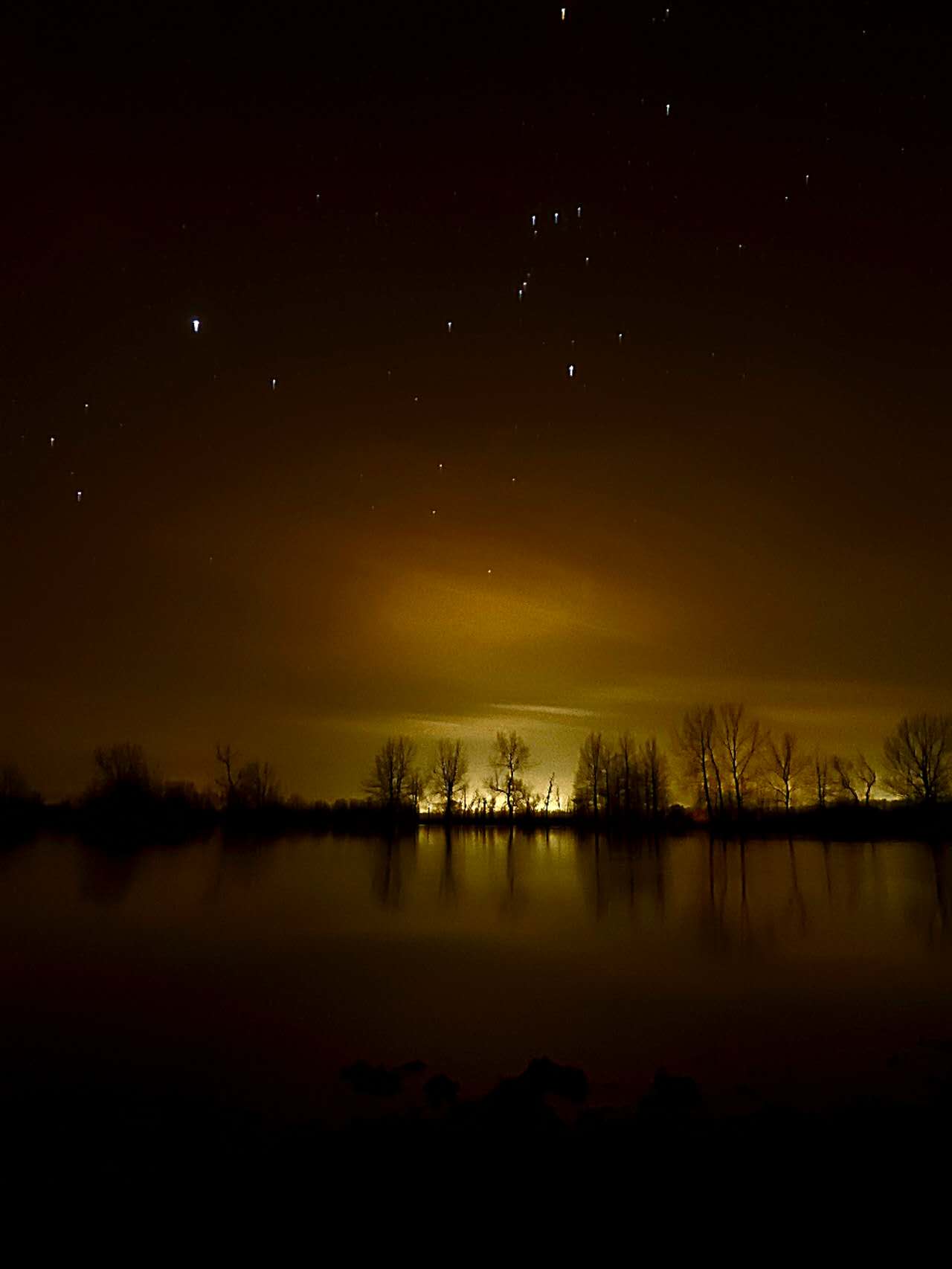 Long exposure shot of the lake with stars Long exposure shot of the lake with stars